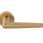 Deurklink BASICS LBXXIH op ronde rozet PVD mat goud