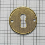 Sleutelplaat rond messing antiek