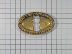 Sleutelplaat ovaal Louis XVI messing antiek