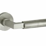 Deurkruk op geveerd rozet Bauhaus/Vivo mat nikkel ongelakt