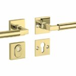 SKG3 kruk/kruk op rozet Bauhaus Rechts + kerntrekbeveiliging messing ongelakt