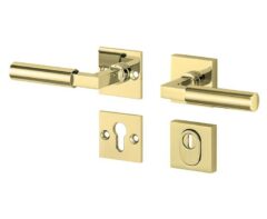 SKG3 kruk/kruk op rozet Bauhaus Links + kerntrekbeveiliging messing ongelakt