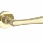 Deurkruk op geveerd rozet Linea/Vivo messing ongelakt