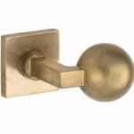 Knopkruk op geveerd rozet verdekt Bauhaus messing antiek