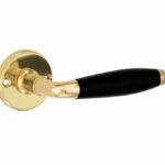 Deurkruk op ongeveerd rozet Bonton ebben/facet messing ongelakt