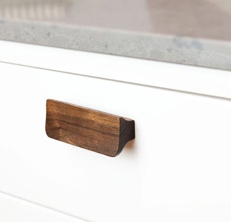 Greep Holsted Walnoot gelakt 64 mm