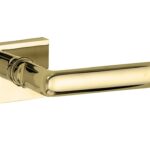 Deurkruk op geveerd rozet verdekt Padania messing ongelakt