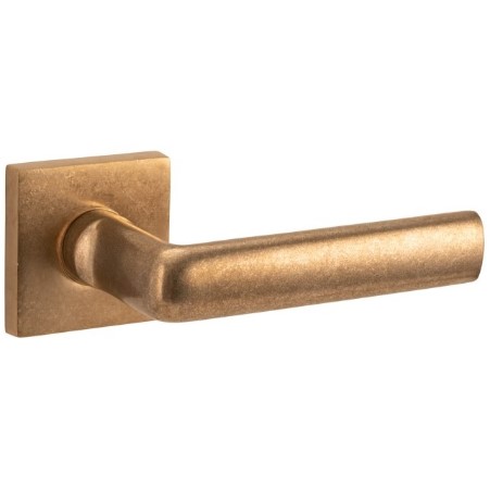 Deurkruk op geveerd rozet verdekt Padania/Bauhaus messing antiek