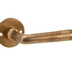 Deurkruk op ongeveerd rozet Art-Deco/Elegant messing antiek