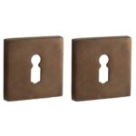 Set van twee Sleutelplaatjes Bauhaus verdekt messing antiek brons